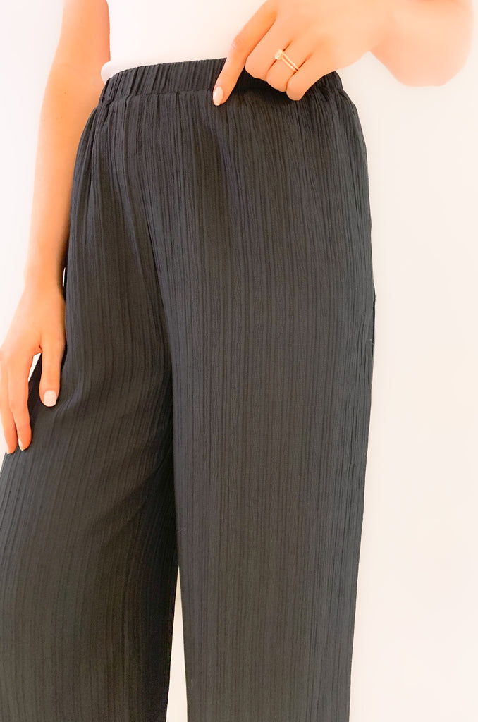 These Wide Leg Ribbed Elastic Waist Pants are the perfect combination of comfort and style! Cropped to perfection, they are so elevated and trendy. The lightweight ribbed elastic material offers both a comfortable fit and a flattering look. Whether you choose black or beige, these flowy cropped pants are an ideal choice for any occasion. 