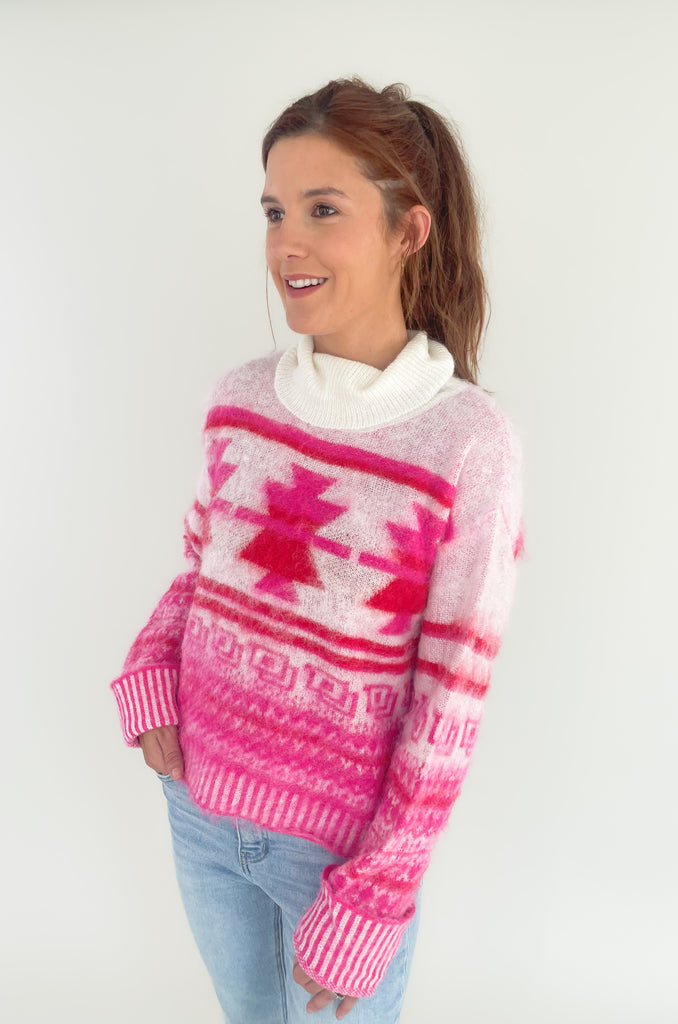 Stay cozy and stylish in this Winter Wonderland Printed Turtleneck Sweater! It features a unique holiday abstract print with an eyelash fabric for a soft, luxurious feel. It really stands out and is the perfect holiday style. We love the turtleneck and slight oversized fit that screams cozy for the holidays! 