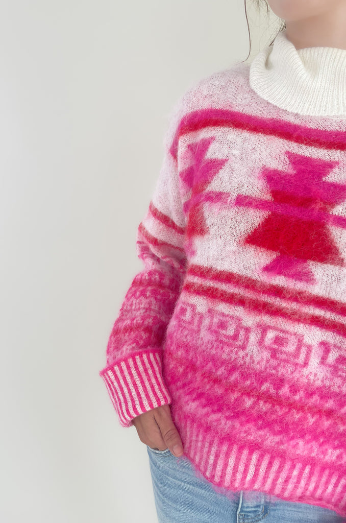 Stay cozy and stylish in this Winter Wonderland Printed Turtleneck Sweater! It features a unique holiday abstract print with an eyelash fabric for a soft, luxurious feel. It really stands out and is the perfect holiday style. We love the turtleneck and slight oversized fit that screams cozy for the holidays! 