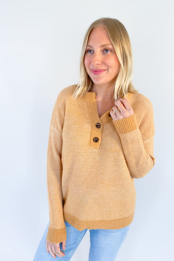 A perfect addition to your year-round wardrobe, the Wish Waffle Knit Henley offers a comfortable fit in a timeless style. Crafted with camel and white yarn and a 3/4 button up design, this henley offers a soft, stretchy feel that is perfect for everyday wear. 