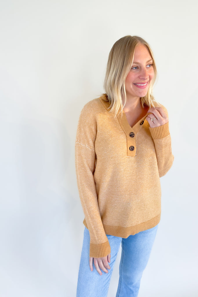 A perfect addition to your year-round wardrobe, the Wish Waffle Knit Henley offers a comfortable fit in a timeless style. Crafted with camel and white yarn and a 3/4 button up design, this henley offers a soft, stretchy feel that is perfect for everyday wear. 