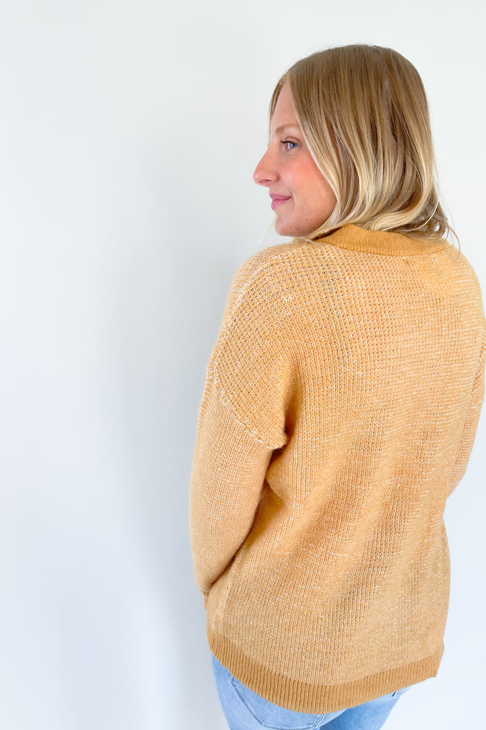 A perfect addition to your year-round wardrobe, the Wish Waffle Knit Henley offers a comfortable fit in a timeless style. Crafted with camel and white yarn and a 3/4 button up design, this henley offers a soft, stretchy feel that is perfect for everyday wear. 