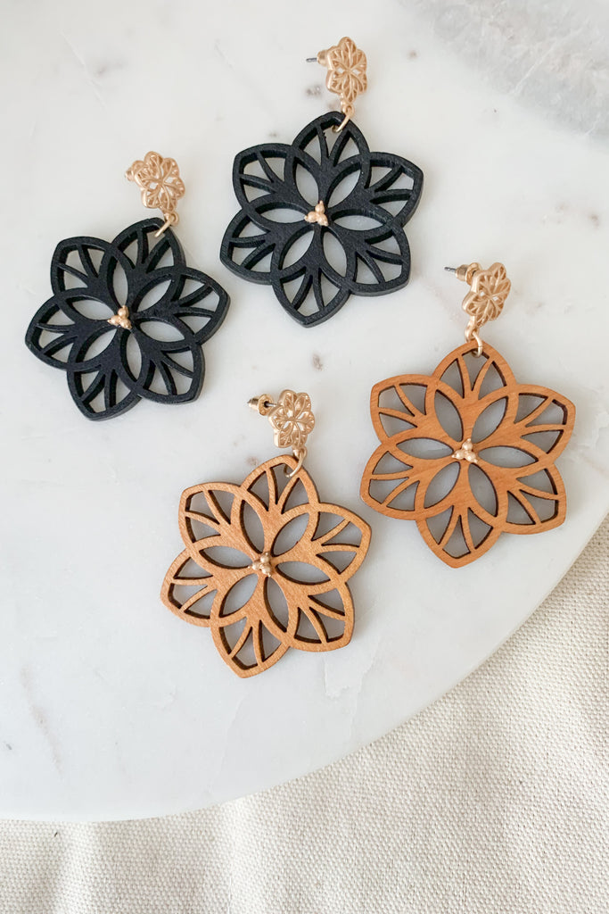 The Wood Flower Drop Earrings are playful and boho. They make a statement with their intricate wooden design. We are loving the gold touches too. Because they drop flower design is made from wood, these earrings are very lightweight too. 