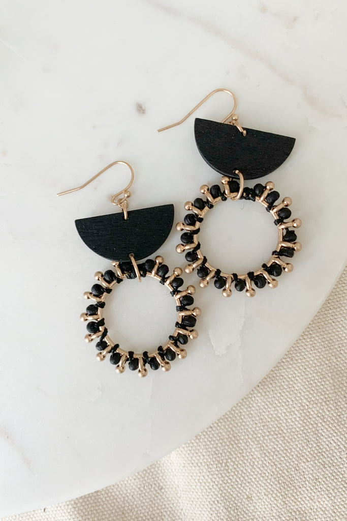 The Wood & Metal Geometic Earrings are lightweight and playful with a hint of boho. We love the mix metal and wood design. It's very unique and makes a statement! Choose between black and brown to complete your look. 