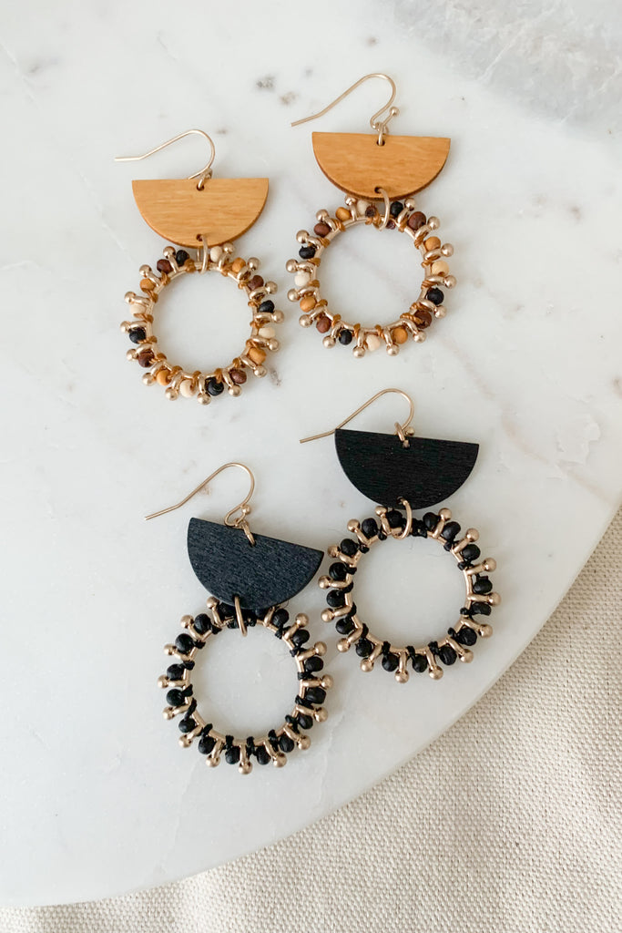 The Wood & Metal Geometic Earrings are lightweight and playful with a hint of boho. We love the mix metal and wood design. It's very unique and makes a statement! Choose between black and brown to complete your look. 