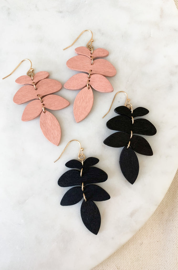 These Wooden 4 piece Linked Wood Leaf Earrings are perfect for adding a touch of style to any outfit! Crafted blush or pink with gold links, the lightweight design is comfortable and fashionable. Wear them day or night for a unique look each time.