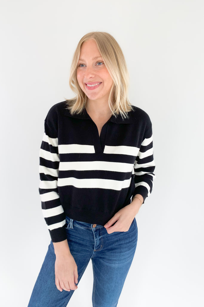 The Charlotte Avery Yang Black & White V Neck Sweater is so classic! Black and white stripes never go out of style, especially when paired with this trendy silhouette. It's collared, semi-cropped, and ultra soft. We love anything cashmere too, so this sweater is definitely one worth scooping up. 