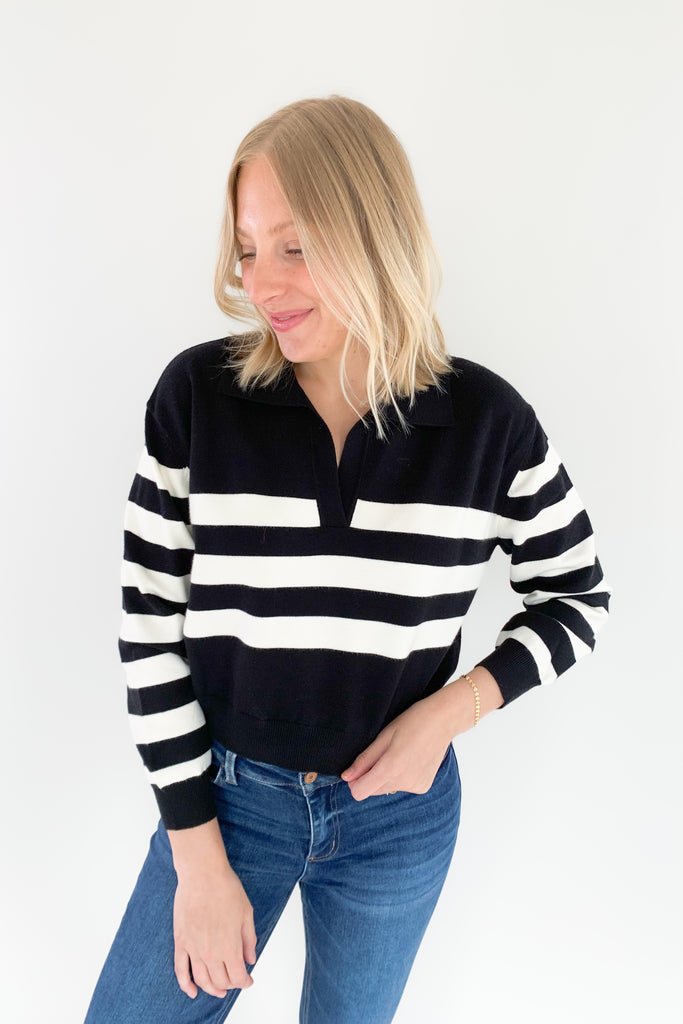 The Charlotte Avery Yang Black & White V Neck Sweater is so classic! Black and white stripes never go out of style, especially when paired with this trendy silhouette. It's collared, semi-cropped, and ultra soft. We love anything cashmere too, so this sweater is definitely one worth scooping up. 