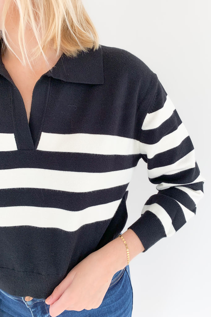 The Charlotte Avery Yang Black & White V Neck Sweater is so classic! Black and white stripes never go out of style, especially when paired with this trendy silhouette. It's collared, semi-cropped, and ultra soft. We love anything cashmere too, so this sweater is definitely one worth scooping up. 