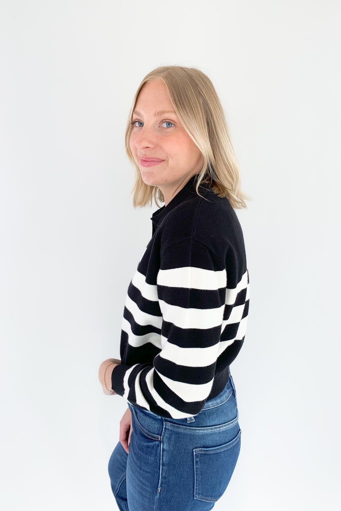 The Charlotte Avery Yang Black & White V Neck Sweater is so classic! Black and white stripes never go out of style, especially when paired with this trendy silhouette. It's collared, semi-cropped, and ultra soft. We love anything cashmere too, so this sweater is definitely one worth scooping up. 