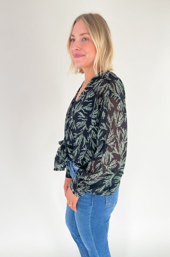 Stay comfortable and stylish with the Yes Please Blouse! Crafted from a light and flowy fabric, this blouse is perfect for transitioning from day to night. The fun print  adds a touch of elegance, while the sheer material keeps you cool and stylish. Layer it over one of our tanks for an effortless look!