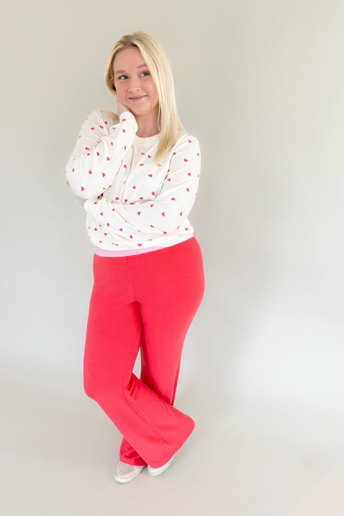 Amp up your casual look with the [Z SUPPLY] Cross Over Flare Pant in Candy Red! This stylish pant features an ultra soft fabric, elastic waistband with criss cross detail, and color block accents for added flair. Enjoy complete comfort with a splash of fun with this Z SUPPLY pant! 