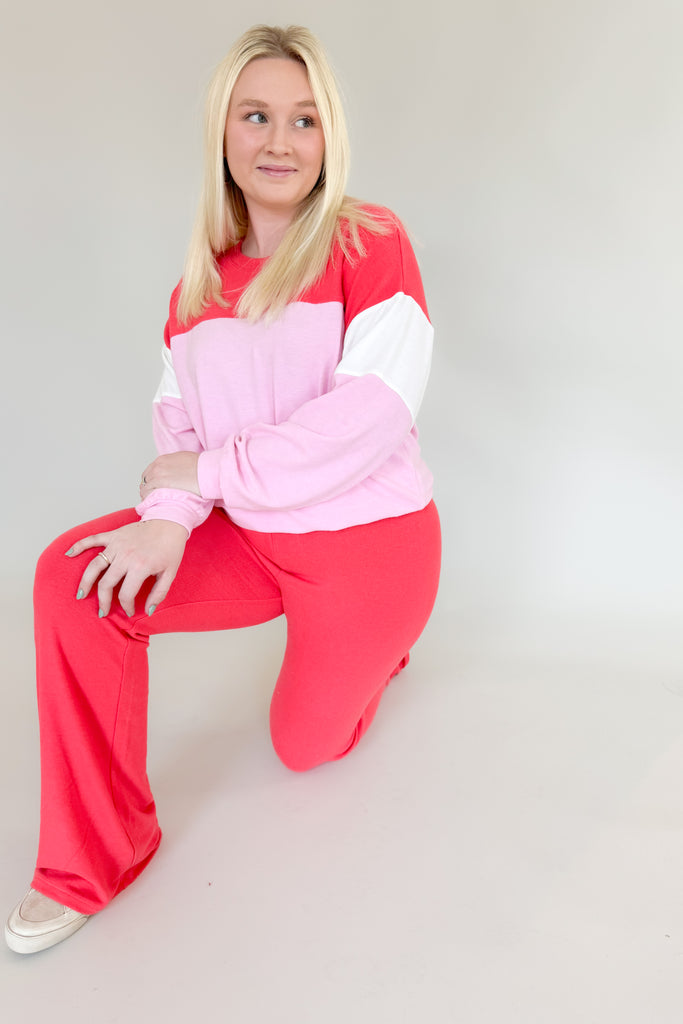 Amp up your casual look with the [Z SUPPLY] Cross Over Flare Pant in Candy Red! This stylish pant features an ultra soft fabric, elastic waistband with criss cross detail, and color block accents for added flair. Enjoy complete comfort with a splash of fun with this Z SUPPLY pant! 