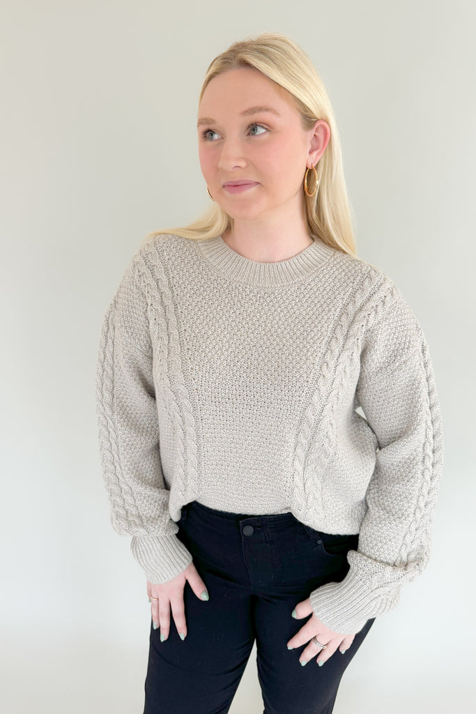 Add some sparkle into your wardrobe this season with this new chunky sweater, made of metallic yarns. The luxe [Z SUPPLY] Eternal Metallic Cable Sweater in Dove has a drop shoulder, crew neckline, and relaxed sleeves that bloussant. This sweater is just as perfect for a night out or a day running errands.