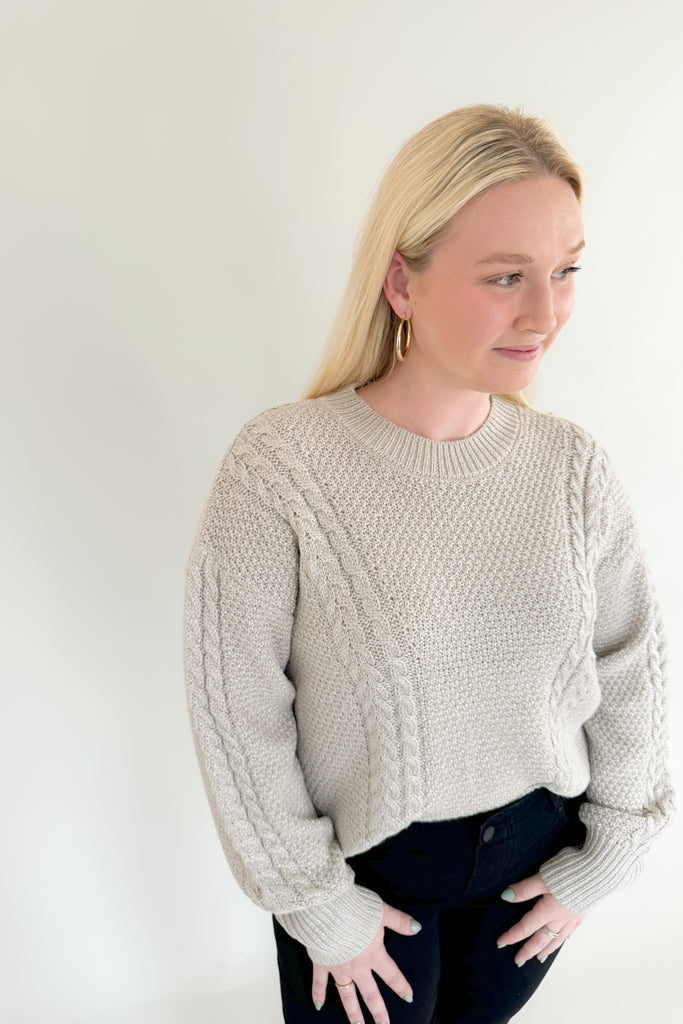 Add some sparkle into your wardrobe this season with this new chunky sweater, made of metallic yarns. The luxe [Z SUPPLY] Eternal Metallic Cable Sweater in Dove has a drop shoulder, crew neckline, and relaxed sleeves that bloussant. This sweater is just as perfect for a night out or a day running errands.