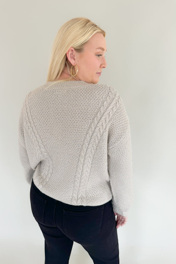 Add some sparkle into your wardrobe this season with this new chunky sweater, made of metallic yarns. The luxe [Z SUPPLY] Eternal Metallic Cable Sweater in Dove has a drop shoulder, crew neckline, and relaxed sleeves that bloussant. This sweater is just as perfect for a night out or a day running errands.