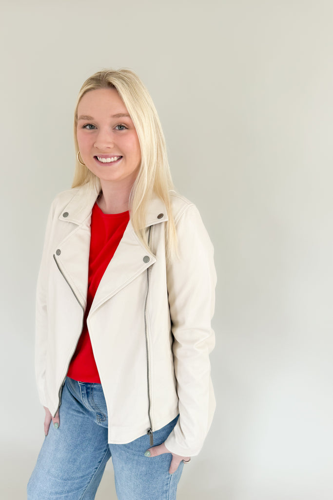 Add an instant edginess to any look with this faux leather statement jacket. The fully lined [Z SUPPLY] Trina Moto Jacket in Ecru is made using Z SUPPLYS vegan faux leather fabric and features an asymmetrical zip front, zippered sleeves, and functional welt pockets for a cool look you'll wanna wear all season. 