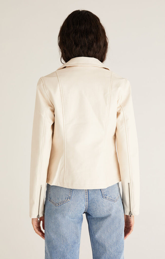 Add an instant edginess to any look with this faux leather statement jacket. The fully lined [Z SUPPLY] Trina Moto Jacket in Ecru is made using Z SUPPLYS vegan faux leather fabric and features an asymmetrical zip front, zippered sleeves, and functional welt pockets for a cool look you'll wanna wear all season. 