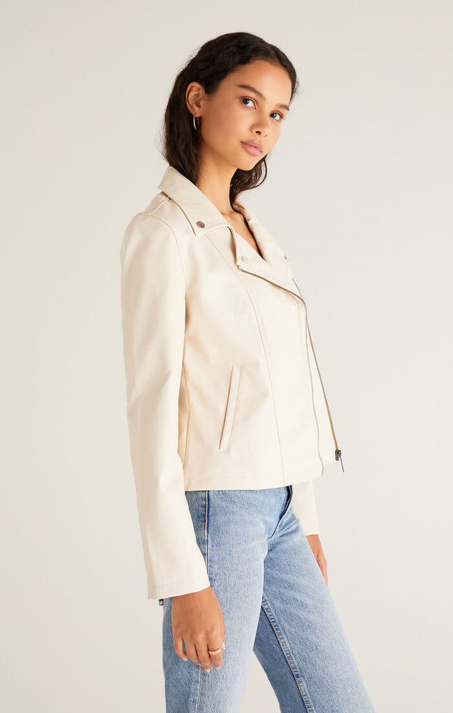 Add an instant edginess to any look with this faux leather statement jacket. The fully lined [Z SUPPLY] Trina Moto Jacket in Ecru is made using Z SUPPLYS vegan faux leather fabric and features an asymmetrical zip front, zippered sleeves, and functional welt pockets for a cool look you'll wanna wear all season. 