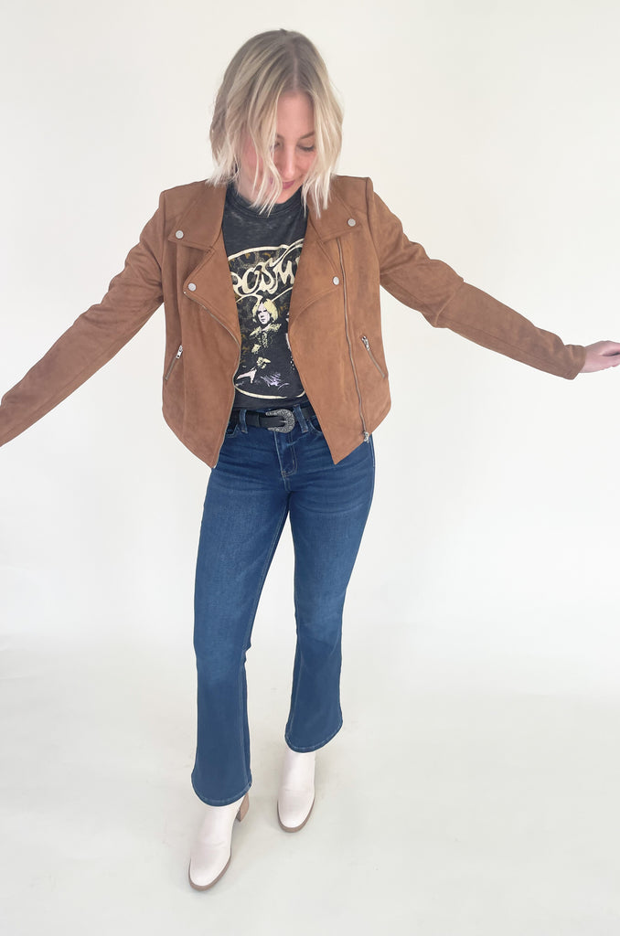 The Aerosmith Back In The Saddle Tee is so comfortable it doesn't even matter how fun it is! But if you love a good band tee, this style is one of the best! It has a cool Aerosmith leopard print graphic on the front and "Back in the Saddle" on the back. Graphic tees are the perfect, cool girl look that's right on trend this season. You will be reaching for it every time you go out, go to a concert, or want to play up your outfit. Try pairing it with our Upgrade Faux Suede Jacket for an easy layering option.