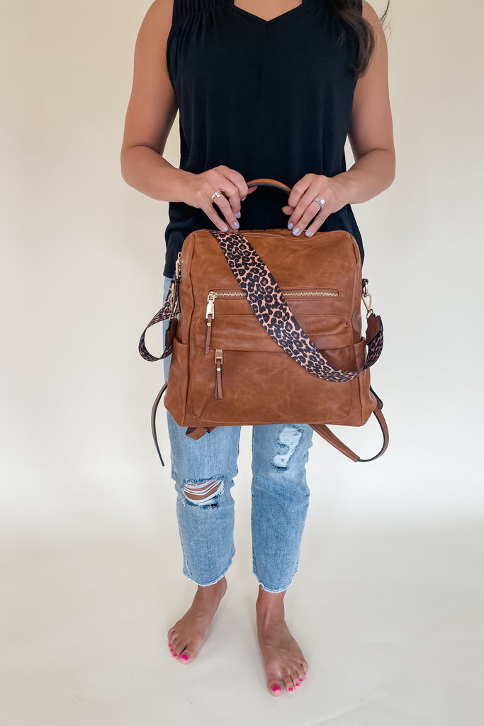 The Amelia Guitar Strap Back Pack is perfect for on-the-go! With multiple interior and exterior pockets, this bag is large enough to fit all the essentials, and more. The faux leather feels really soft and is great quality. The inside is quilted too. Each bag has the traditional faux leather adjustable straps, but also comes with an exclusive guitar strap.