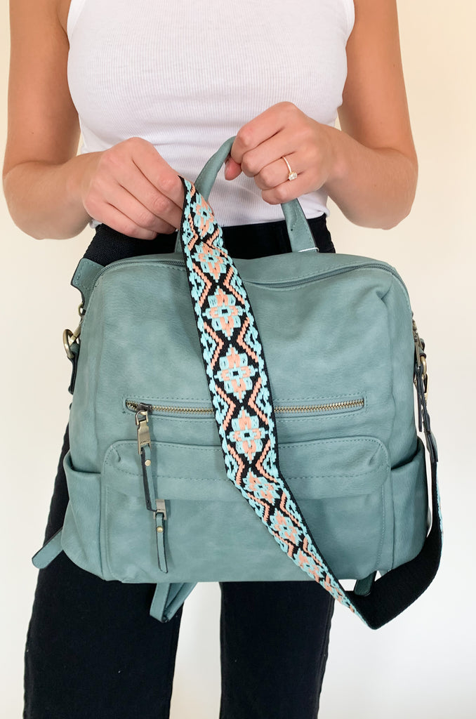 The Amelia Guitar Strap Back Pack is perfect for on-the-go! With multiple interior and exterior pockets, this bag is large enough to fit all the essentials, and more. The faux leather feels really soft and is great quality. The inside is quilted too. Each bag has the traditional faux leather adjustable straps, but also comes with an exclusive guitar strap.