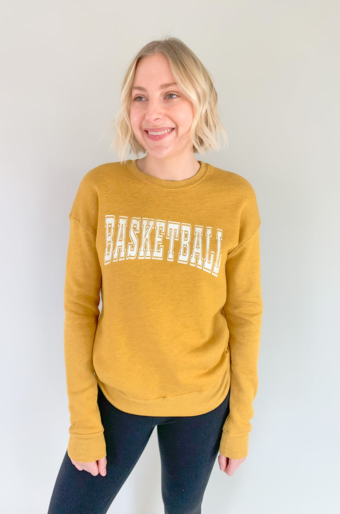 Get gamely ready with our new Basketball Graphic Pullover! It is perfect for every gal on-the-go and from one of our bestselling vendors! The fabric is ultra cozy and washes so well. You will be reaching for it again and again! 