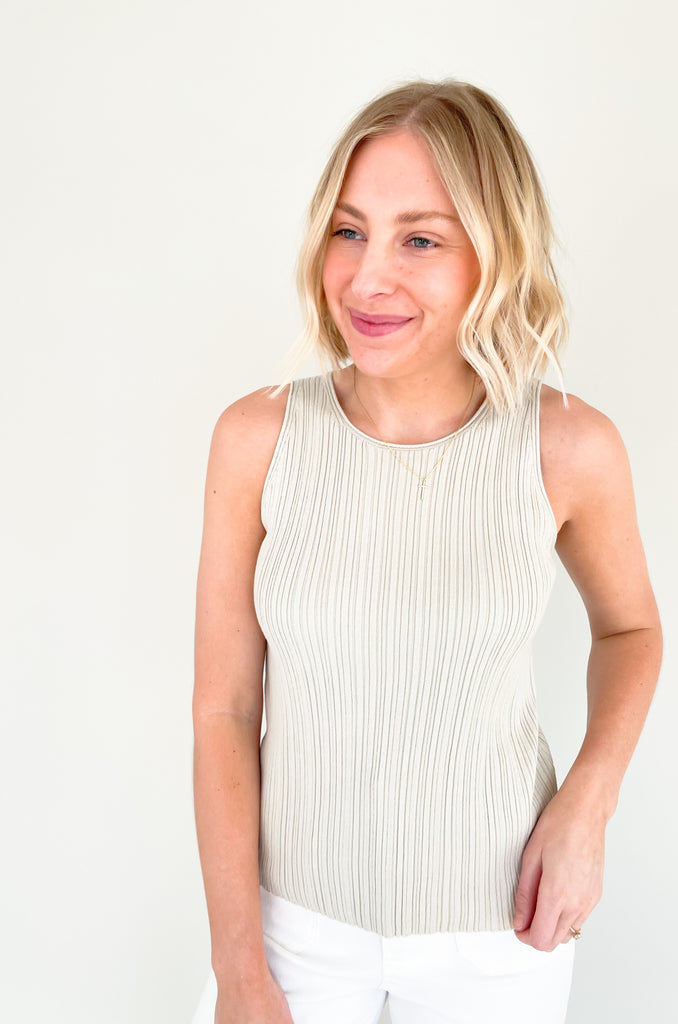 Upgrade your wardrobe with our Becca Basic Knit Ribbed Tank- a must-have staple piece for any fashion-forward individual. Available in two classic colors - off white and beige/green - this tank is perfect for any occasion.