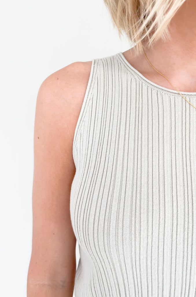 Upgrade your wardrobe with our Becca Basic Knit Ribbed Tank- a must-have staple piece for any fashion-forward individual. Available in two classic colors - off white and beige/green - this tank is perfect for any occasion.
