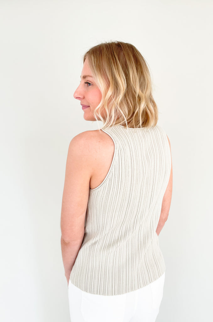 Upgrade your wardrobe with our Becca Basic Knit Ribbed Tank- a must-have staple piece for any fashion-forward individual. Available in two classic colors - off white and beige/green - this tank is perfect for any occasion.