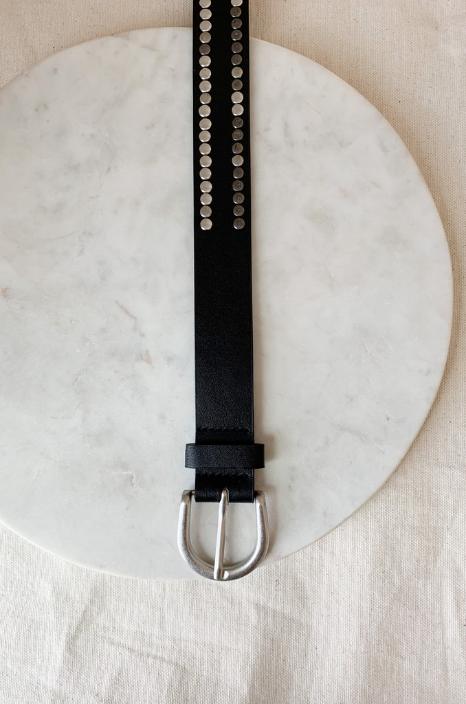 The Black Belt with Silver Mini Dots is 43" long. It is a faux leather belt with multi colored studs. Some are silver while others are more slate great. It is unique with a slightly edgy look. 