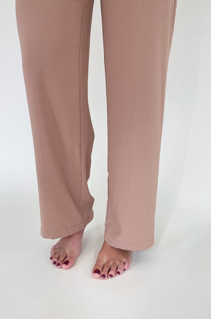 Elevated, lightweight, and comfortable are the qualities we look for in a good pant. The Board Room High Waist Woven Pant is just that and comes in two classic colors: Black and Camel. These wide leg bottoms are perfect for work and special events. They have a zipper fly with a hook enclosure at the top, functional pockets, and belt loops. You cannot go wrong with a staple-piece like quality slacks. 