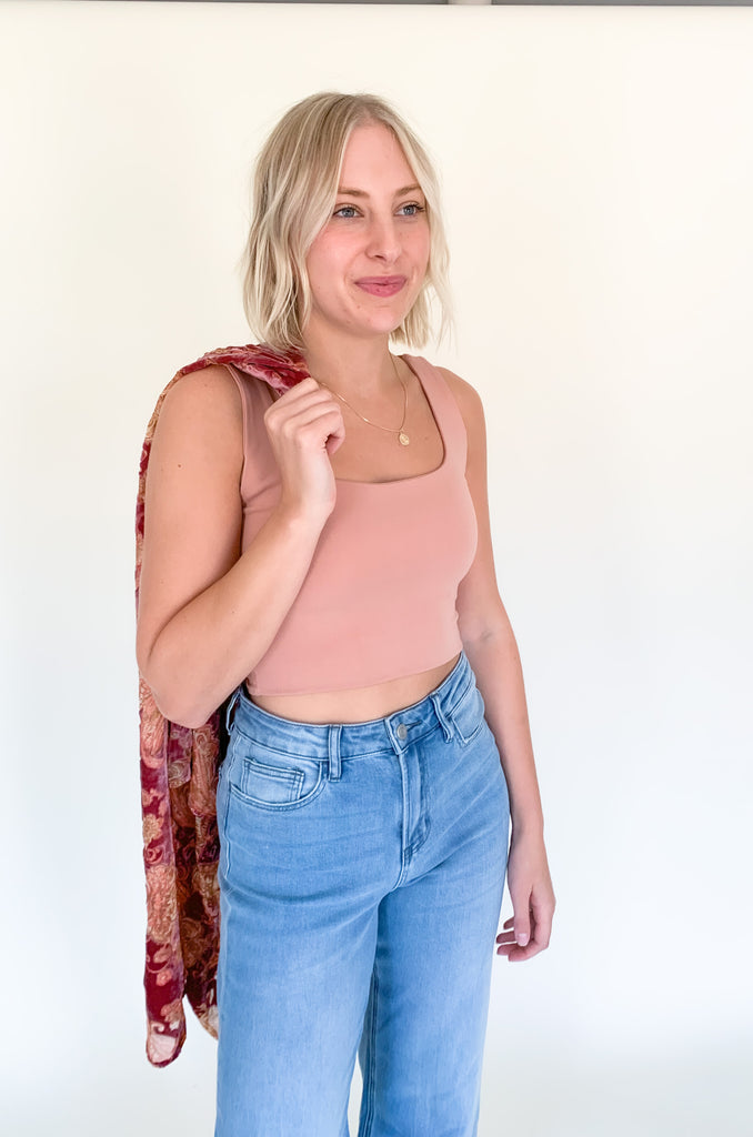 The Desert Rose Velvet Burnout Kimono is absolutely stunning. It is elegant with rich colors and soft textures. The fabric is fairly lightweight, but the hint of velvet speaks to fall fashion. We are obsessed with the mauve and burgundy hues combined with the floral print. You can layer it over so many looks too. It's a must-have!