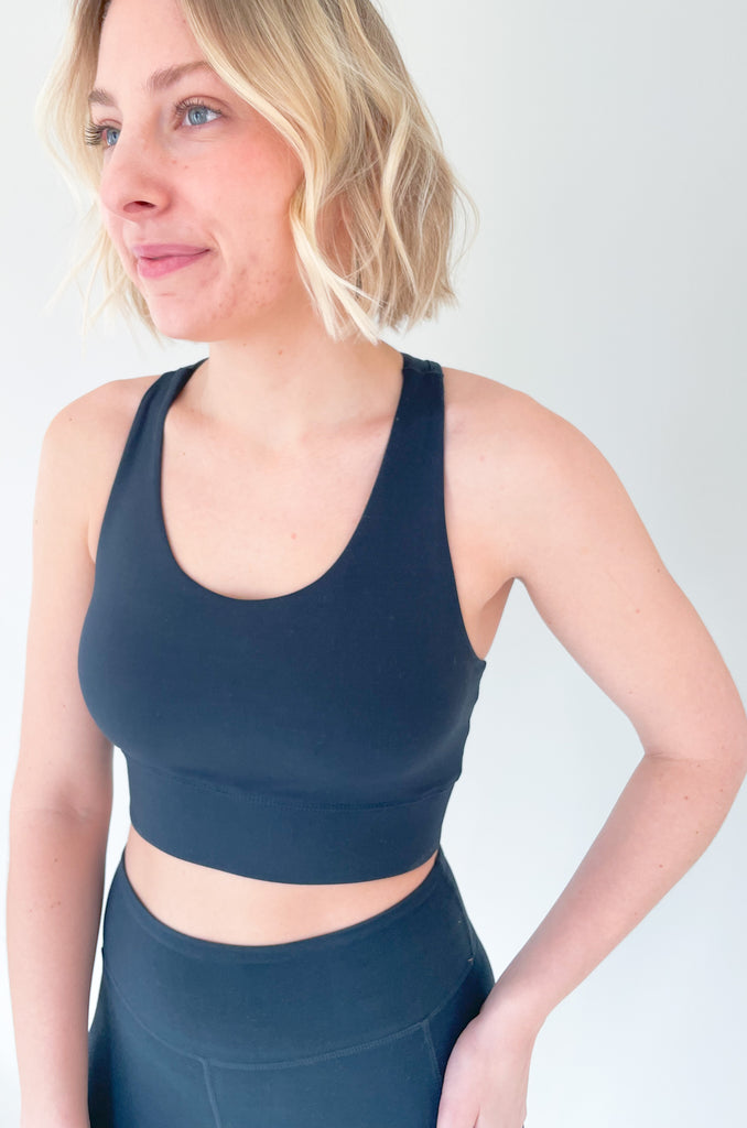 The Butter Soft Racerback Sports Bra is a new favorite! You can wear it to the gym or everyday for comfortable support. The fabric really is buttery soft and so elevated. We paired it under our new zip up jacket and drill leggings for a sporty look!