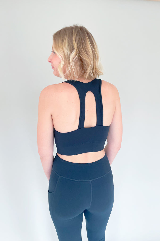 The Butter Soft Racerback Sports Bra is a new favorite! You can wear it to the gym or everyday for comfortable support. The fabric really is buttery soft and so elevated. We paired it under our new zip up jacket and drill leggings for a sporty look!