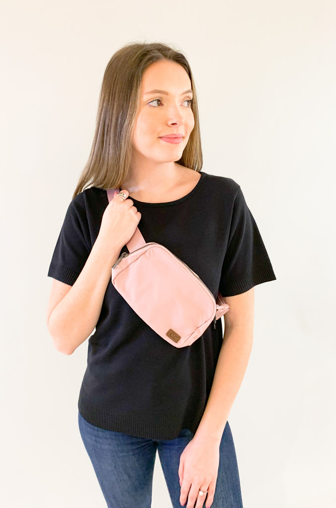 The C.C  Waterproof Mini Belt Bags are made for women on the go! You can wear them as a traditional "fanny pack" belt bag, or try the sling bag trend. Either way, this mini accessory is hands free and effortless. It has multiple inner storage compartments with an extra exterior zipper pocket on the bag. On the front, there is a small brown faux leather cc logo. 
