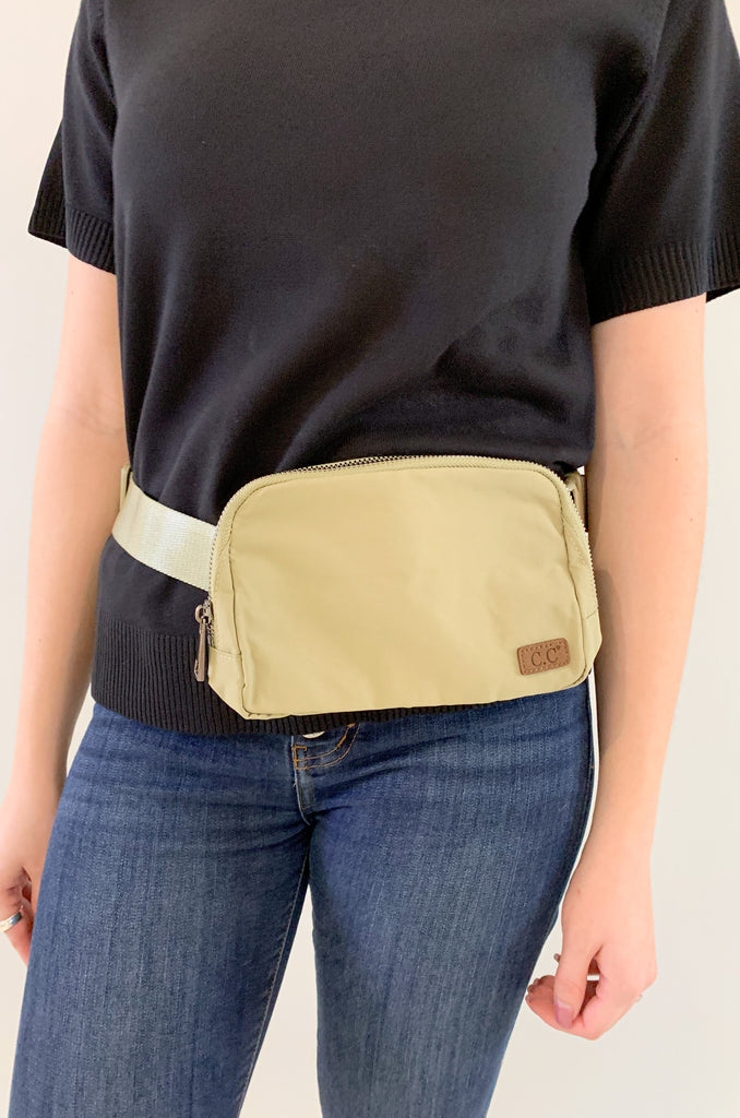 The C.C  Waterproof Mini Belt Bags are made for women on the go! You can wear them as a traditional "fanny pack" belt bag, or try the sling bag trend. Either way, this mini accessory is hands free and effortless. It has multiple inner storage compartments with an extra exterior zipper pocket on the bag. On the front, there is a small brown faux leather cc logo. 