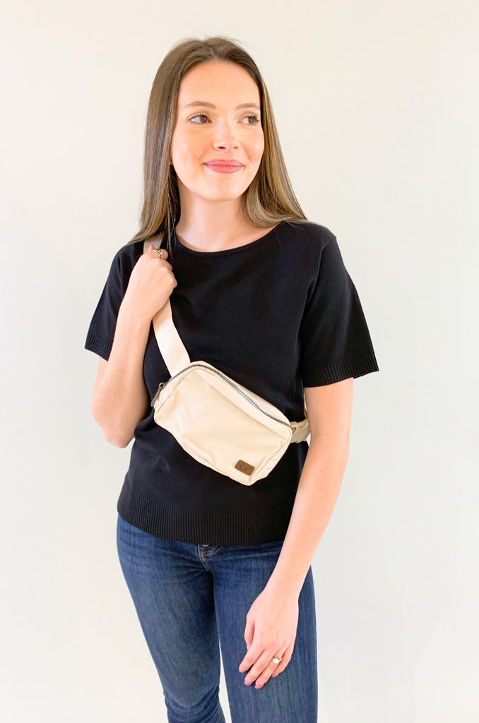 The C.C  Waterproof Mini Belt Bags are made for women on the go! You can wear them as a traditional "fanny pack" belt bag, or try the sling bag trend. Either way, this mini accessory is hands free and effortless. It has multiple inner storage compartments with an extra exterior zipper pocket on the bag. On the front, there is a small brown faux leather cc logo. 