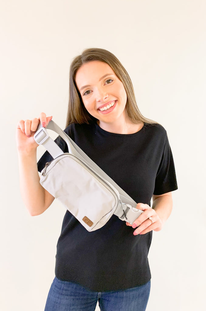 The C.C  Waterproof Mini Belt Bags are made for women on the go! You can wear them as a traditional "fanny pack" belt bag, or try the sling bag trend. Either way, this mini accessory is hands free and effortless. It has multiple inner storage compartments with an extra exterior zipper pocket on the bag. On the front, there is a small brown faux leather cc logo. 