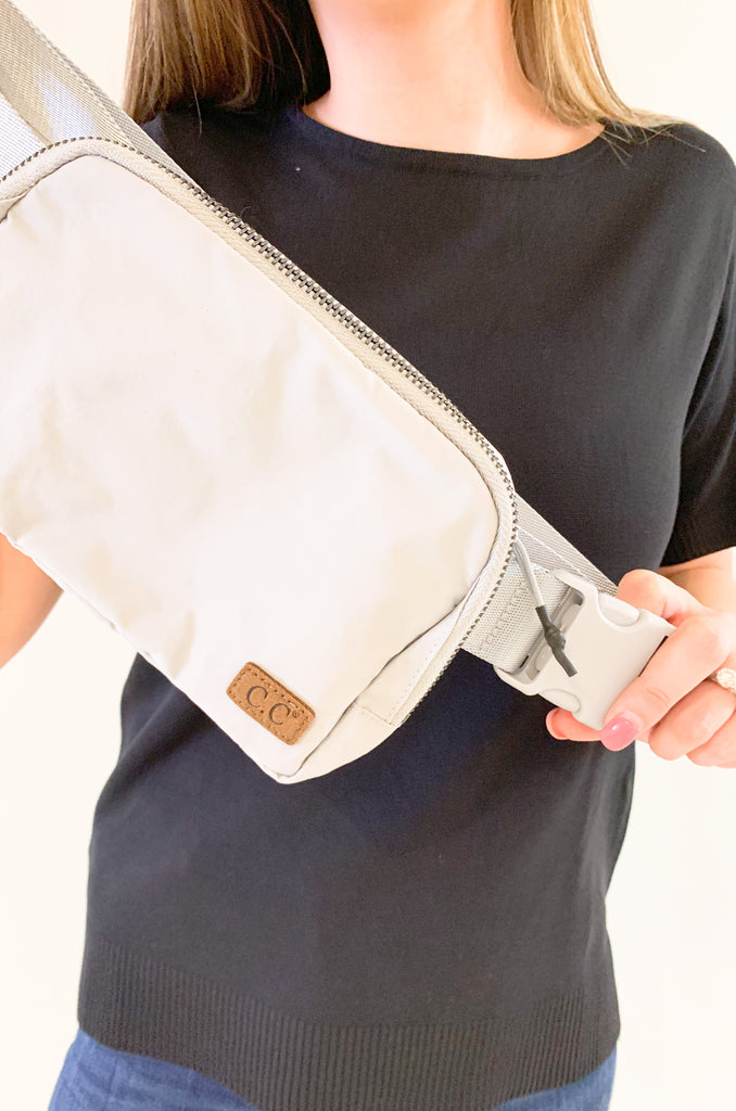 The C.C  Waterproof Mini Belt Bags are made for women on the go! You can wear them as a traditional "fanny pack" belt bag, or try the sling bag trend. Either way, this mini accessory is hands free and effortless. It has multiple inner storage compartments with an extra exterior zipper pocket on the bag. On the front, there is a small brown faux leather cc logo. 