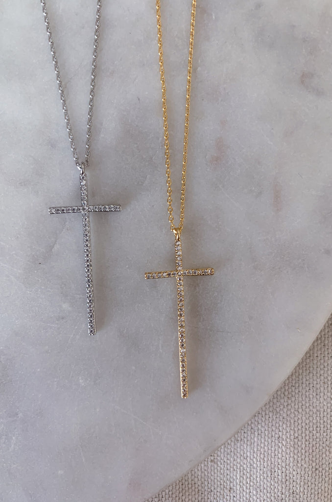 The Dainty Large Cross CZ Necklaces are a great everyday, all year necklace. This necklaces has a beautiful long studded dainty cross. The adjustable chain allows for easy layering, or a great gift. These lightweight necklaces come in silver or gold.