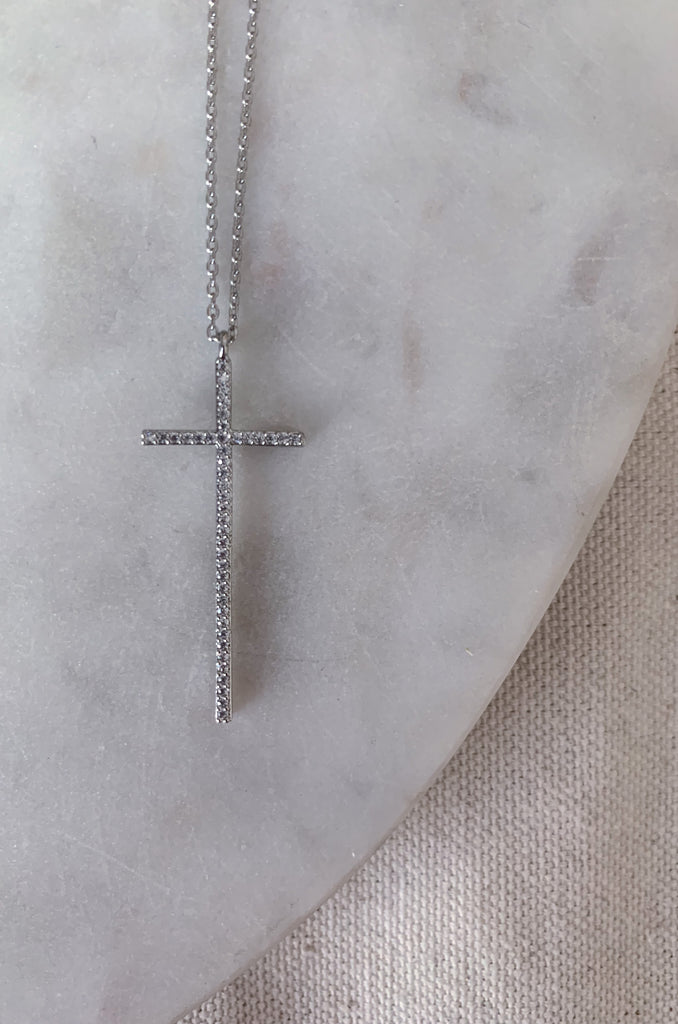 The Dainty Large Cross CZ Necklaces are a great everyday, all year necklace. This necklaces has a beautiful long studded dainty cross. The adjustable chain allows for easy layering, or a great gift. These lightweight necklaces come in silver or gold.