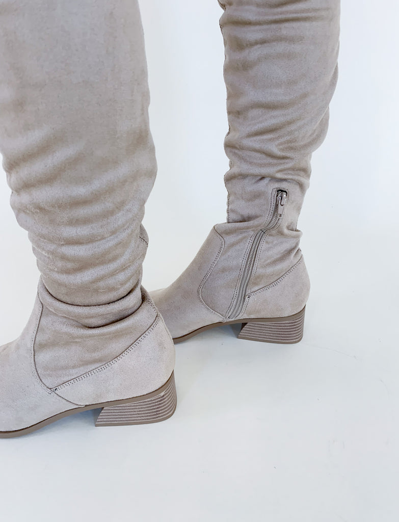 The Deena Over the Knee Faux Suede Boot is right on trend this season! Tall boots instantly elevate your look, plus these are ver comfortable. They have the softest vegan suede material, a side zipper, and a slight heel. Pair these boots with your favorite dress, skirt, or over jeans for an effortless look! 