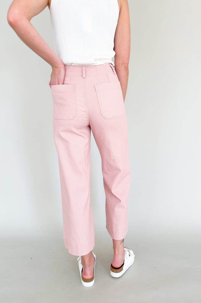 high rise colored wide leg pants with front pockets. This jean comes in pink, black, and off-white