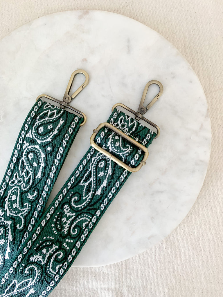 Make your favorite bag pop with these amazing Fabric Guitar Straps! They are so pretty and a very trendy. Each one is unique and durable. You can detach it an add it to any bag. At each end, there are gold tone metal clasps. 