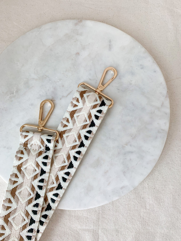 Make your favorite bag pop with these amazing Fabric Guitar Straps! They are so pretty and a very trendy. Each one is unique and durable. You can detach it an add it to any bag. At each end, there are gold tone metal clasps. 