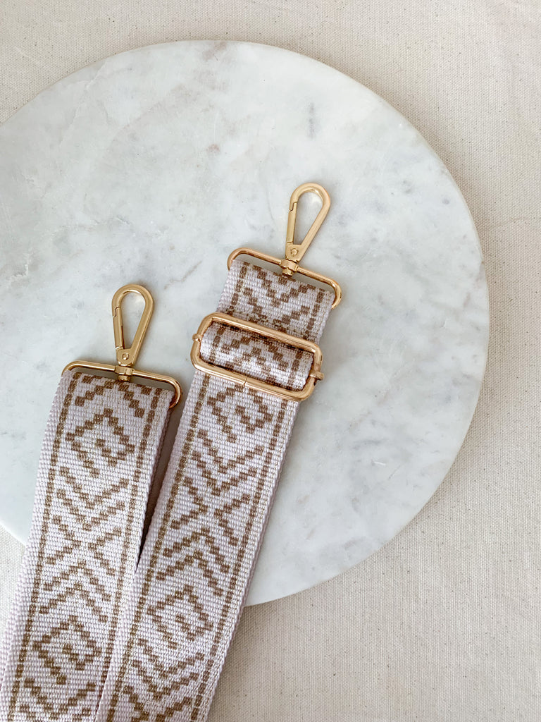 Make your favorite bag pop with these amazing Fabric Guitar Straps! They are so pretty and a very trendy. Each one is unique and durable. You can detach it an add it to any bag. At each end, there are gold tone metal clasps. 