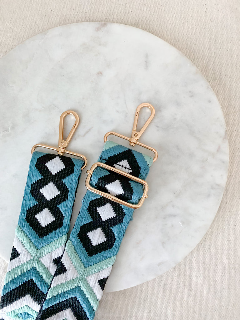 Make your favorite bag pop with these amazing Fabric Guitar Straps! They are so pretty and a very trendy. Each one is unique and durable. You can detach it an add it to any bag. At each end, there are gold tone metal clasps. 