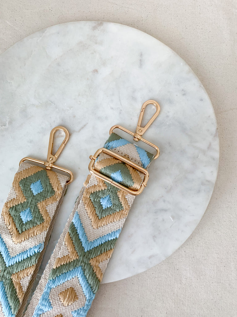 Make your favorite bag pop with these amazing Fabric Guitar Straps! They are so pretty and a very trendy. Each one is unique and durable. You can detach it an add it to any bag. At each end, there are gold tone metal clasps. 