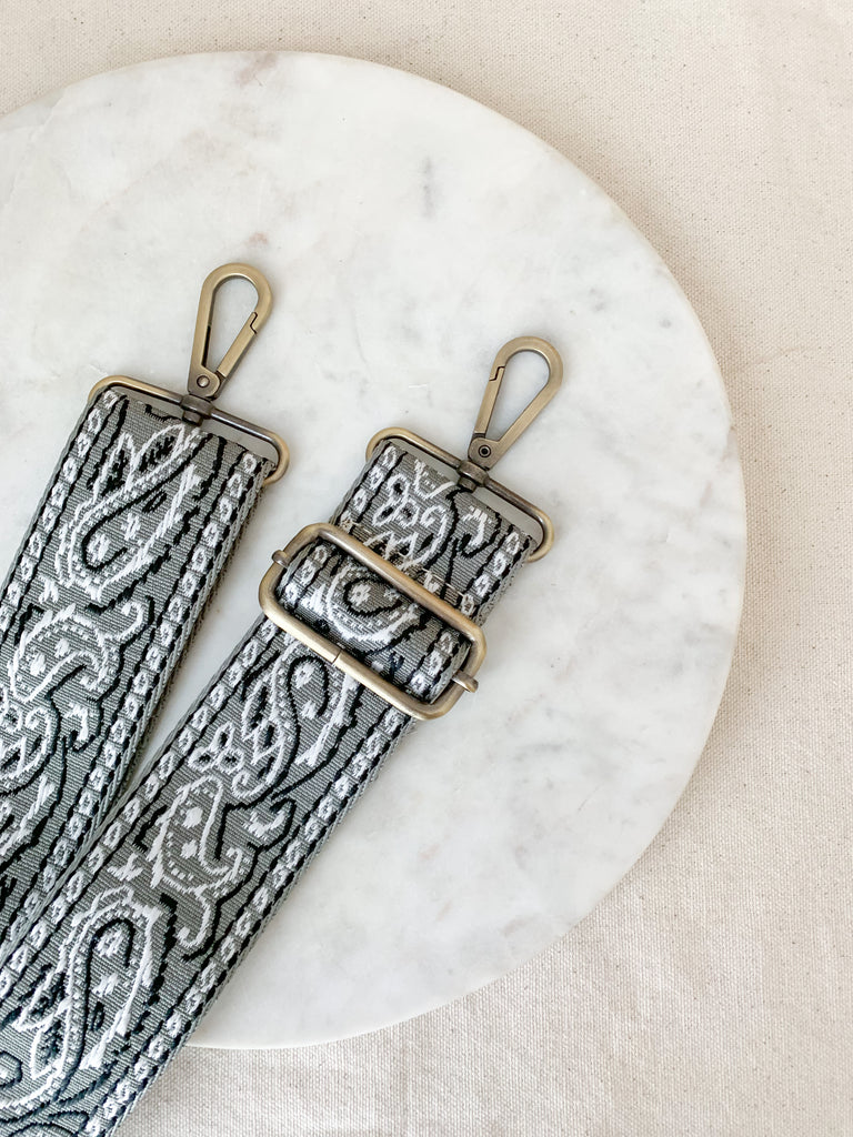 Make your favorite bag pop with these amazing Fabric Guitar Straps! They are so pretty and a very trendy. Each one is unique and durable. You can detach it an add it to any bag. At each end, there are gold tone metal clasps. 